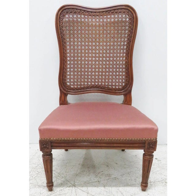 Caned back. Carved walnut frame. Red upholstered seat. Seat height 13"h.