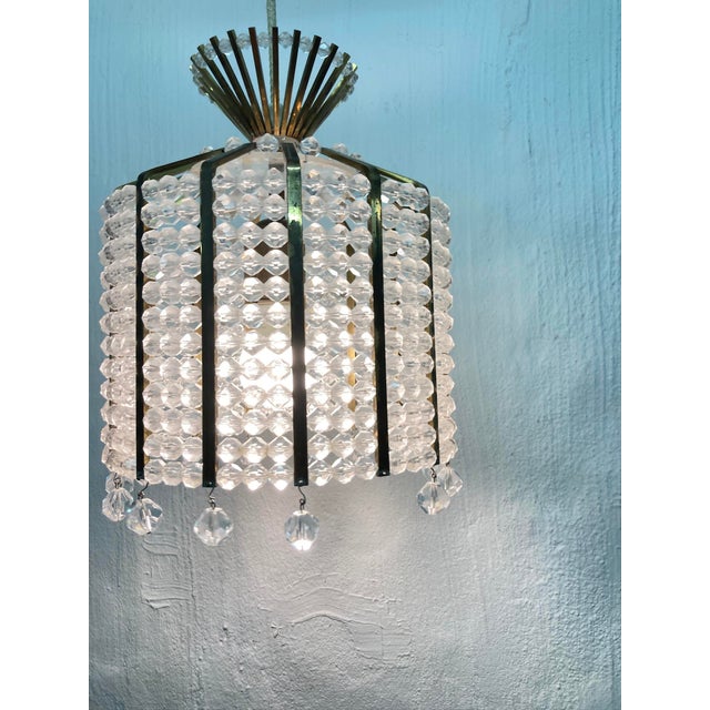 One pendant lamp from the 1950s, single-bulb, E27 socket. The design is attributed to Emil Stejnar for Nikoll. Plexiglas...