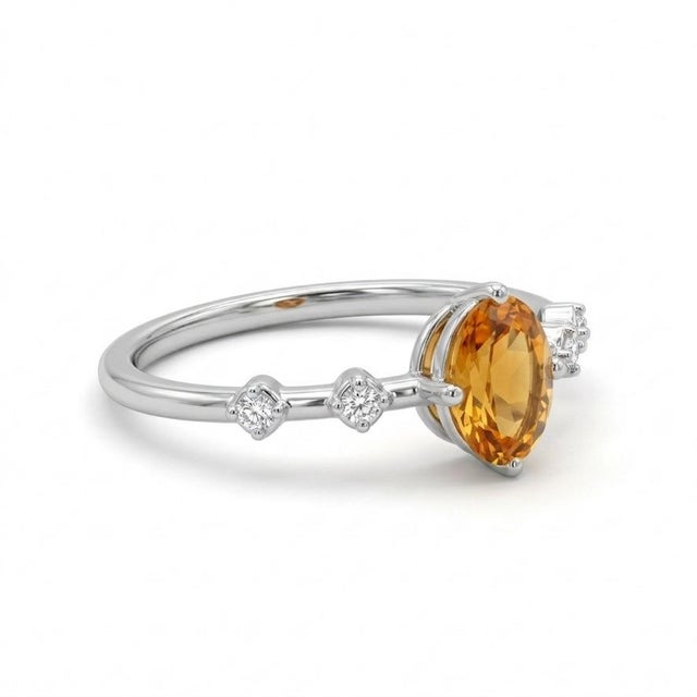 This elegant ring features a radiant Citrine gemstone, admired for its warm golden-yellow hue and vibrant brilliance....