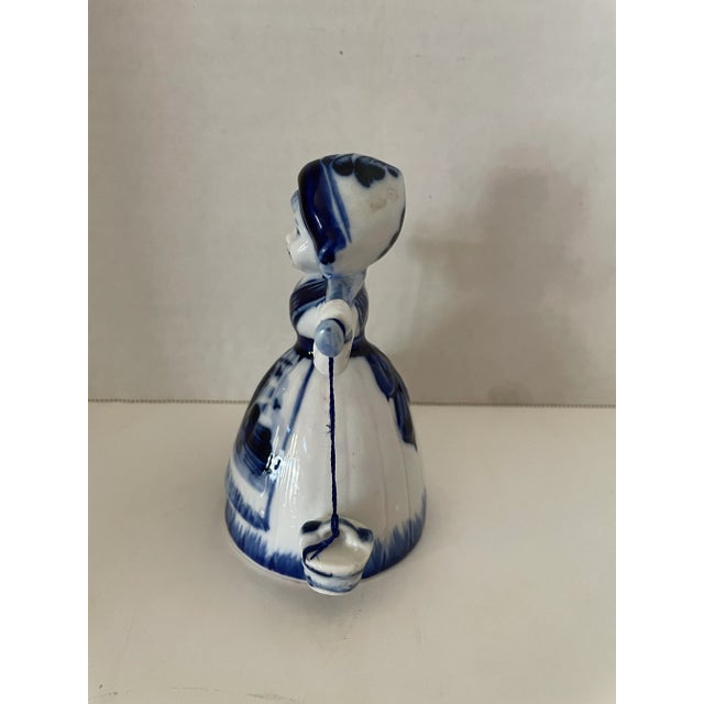 Vintage Delft blue and white porcelain hand painted Holland milkmaid carrying bells Very cute and collectable . Marked...