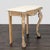 Stone top on carved base with cabriole legs and paw feet. Dimensions (in): 42W x 21D x 37H.