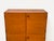 Timeless teak cabinet with four doors and original solid wood frame in a Scandinavian, minimalist design. The cabinet...