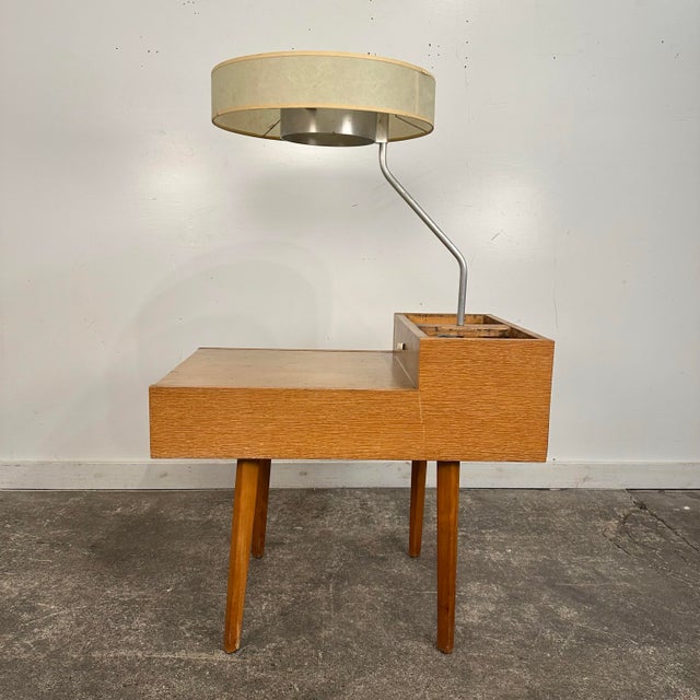 Mid century Modern Side Table with attached lamp and planter by George Nelson for Herman Miller Model 4634-L. This 1950s...