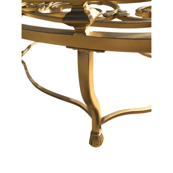 This is a Rococo style coffee table crafted in France during the late 17th century. The table features a gilt patina...