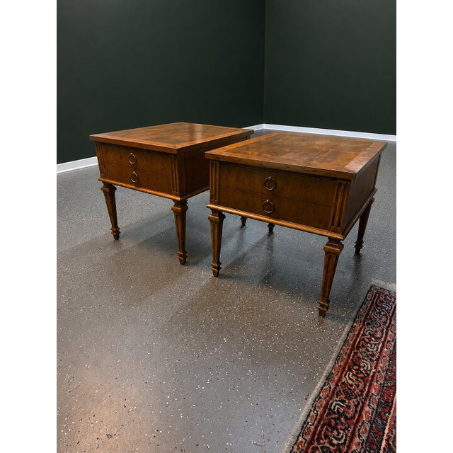 A sophisticated pair of vintage 1960’s nightstands by Heritage Furniture, featuring beautifully figured wood grain and a...