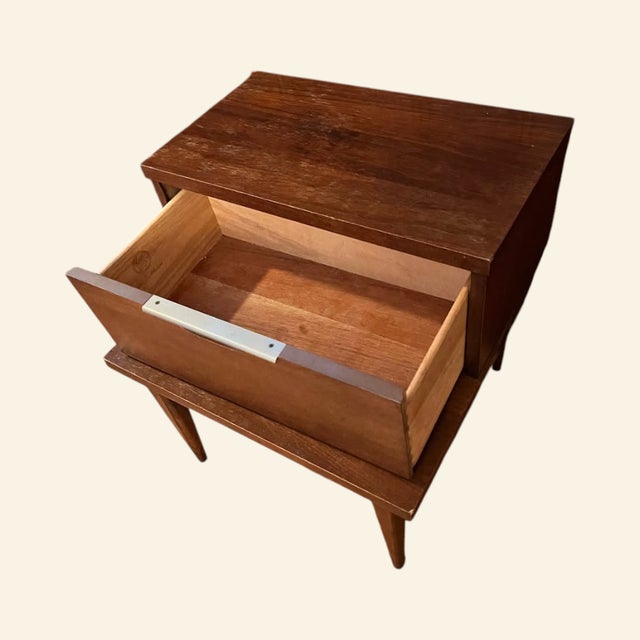 Beautiful mid century nightstand from the Kent Coffey Tableau line. This piece has such great lines, the two-tier design,...