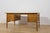 This oak executive desk was manufactured in Denmark during the 1960s. The piece represents the characteristic qualities of...