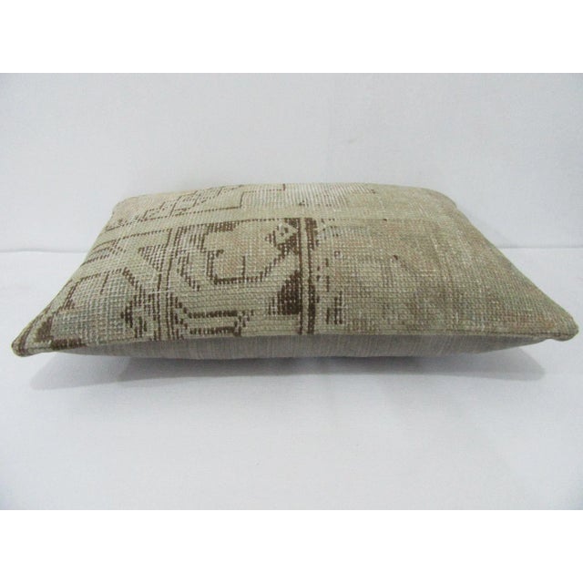 Decorative pillow cover made from a vintage Turkish handknotted rug. Backed with good quality cotton fabric. Pillow...