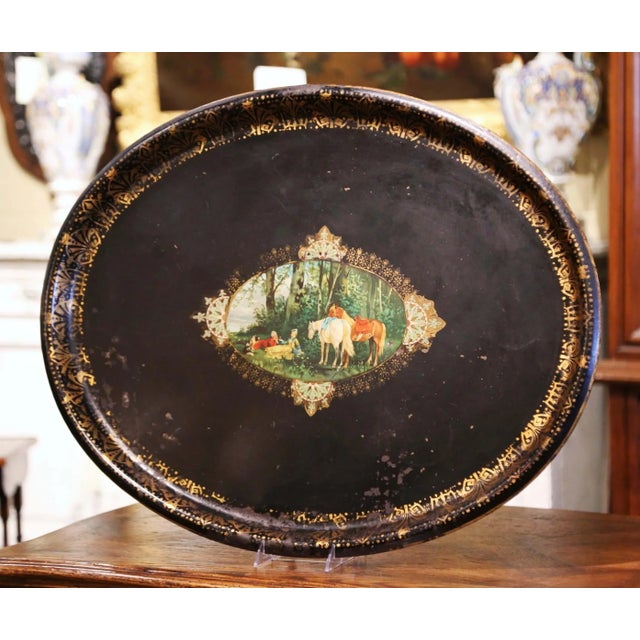 This elegant antique tray was created in France, circa 1870. Oval in shape, the large black tole platter is embellished by...