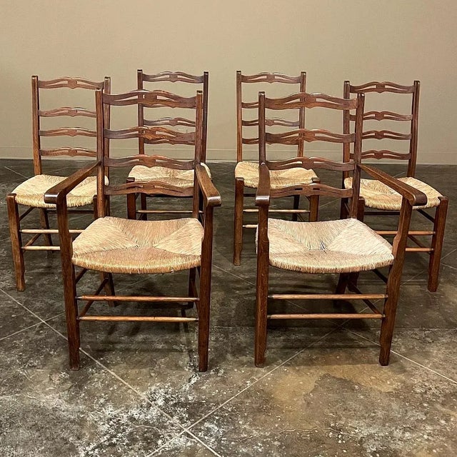 Set of 6 Country French Dining Chairs with Rush Seats includes 2 Armchairs are of a classic ladderback design, and feature...