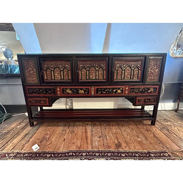 Magnificent multi drawer and compartment antique console cabinet from the Fujian Province of China, having meticulously...