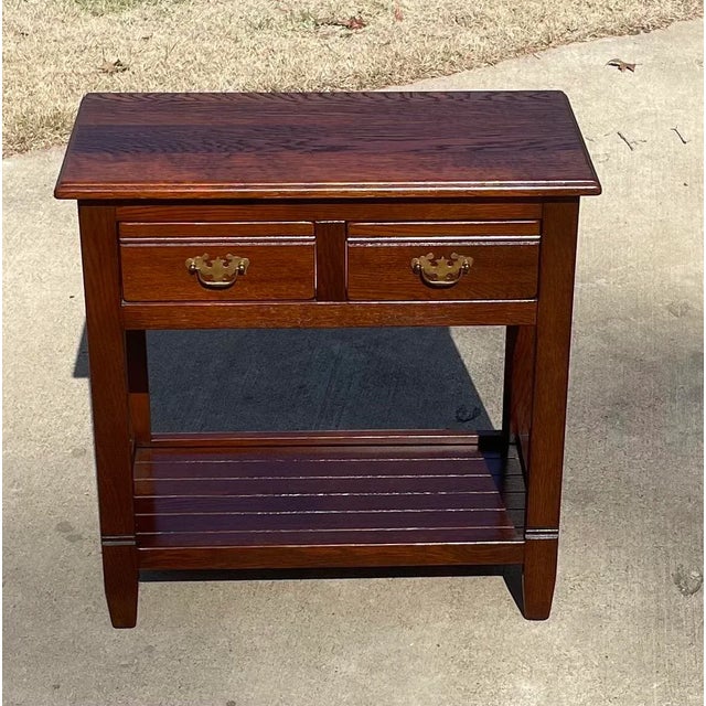 Love this nice solid wood console table with two drawers and a lower “pot board” shelf.