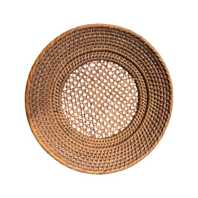 Beautiful vintage woven rattan charger plate with a warm natural honey-brown finish and richly textured woven...