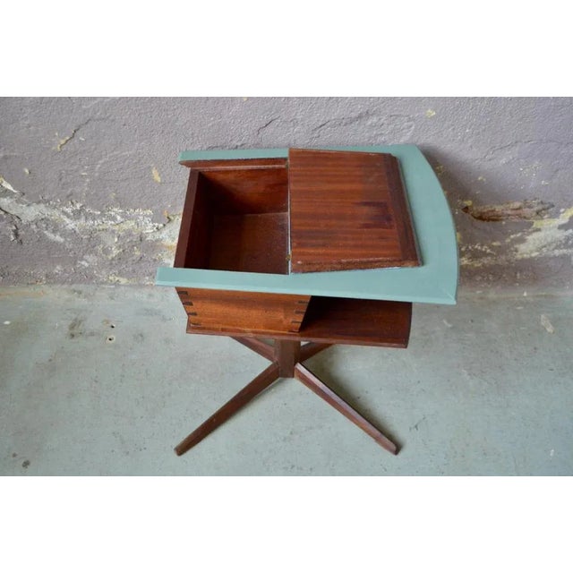 This charming work box has an original, neat and elegant silhouette. A unique star foot in solid wood supports a downward...