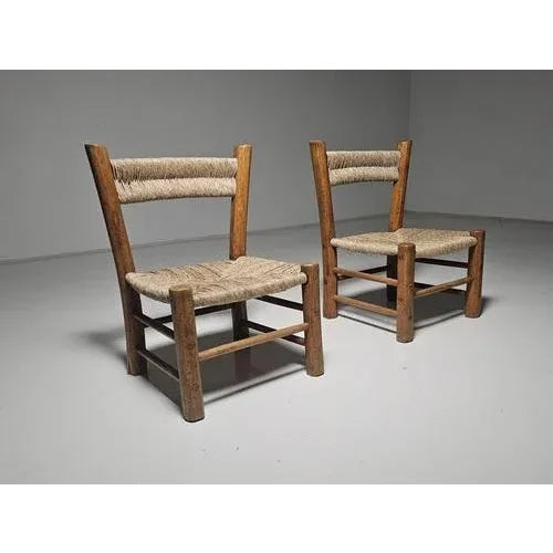 Set of 2 chairs, elmwood, straw, France, 1960s. These beautifully constructed farmer low chairs have a rustic character...