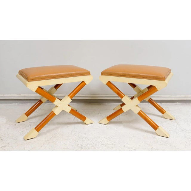 Bespoke Pair of Georgetta Parchment and Walnut X-Frame Benches Upholstered in Leather. Set of 2. Please note that...