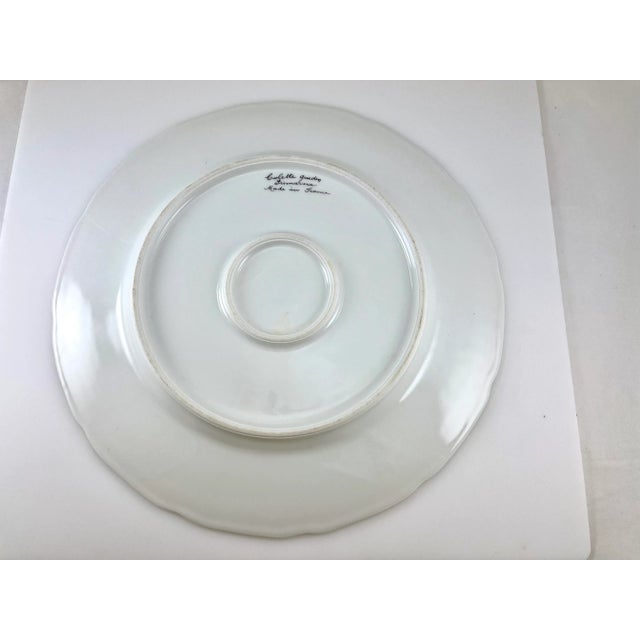 This is a gorgeous hand painted Colette Gueden (1905 - 2000) signed cabinet plate 12.5" c.1950. It was made in France....