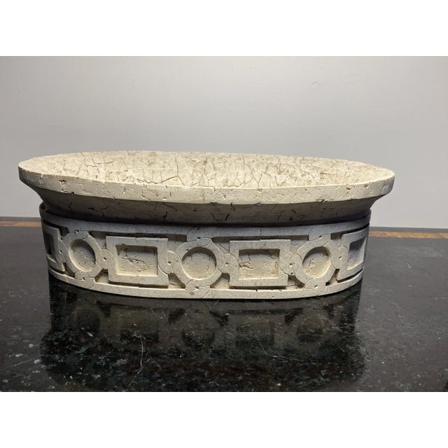 Beautiful off-white oval limestone decorative piece with intricate architectural design carefully pieced on wrapping...