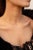 Diamond Necklace in 14K Gold studded with round cut brown and white diamonds. Accessorize your look with this elegant...