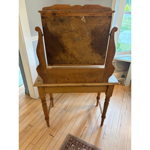 Up for sale in Sunapee Harbor is an Antique Scrubbed Pine Dressing Table w/ its original mirror and hardware. This piece...