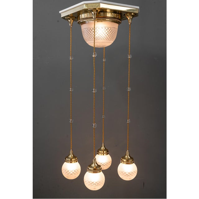 Art Deco chandelier with original cut glass shades vienna around 1920s Brass polished and stove enameled Original antique...