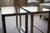 This is a pair of glass and brass side tables in the style of 1950s. They are a perfect match in any contemporary or...