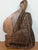 Bring striking tribal artistry and architectural dimension to your walls with this powerful decorative hand-carved wood...