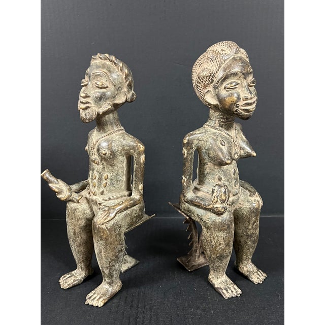 ITEM NAME: Pair of African Tribal Art Benin Bronze Royal Statue ORIGIN: Nigeria AGES: Late 20th Century MATERIALS: Bronze...