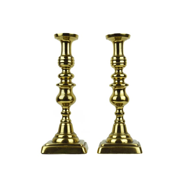 This exquisite pair of solid brass candlesticks are showcasing the exceptional casting and weight characteristic of turn-...