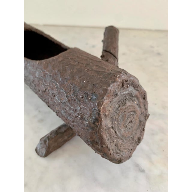 A gorgeous Trompe L'oeil faux bois log-form planter USA, Circa Mid-20th Century Hand-made cast iron Measures: 10.25"W x...