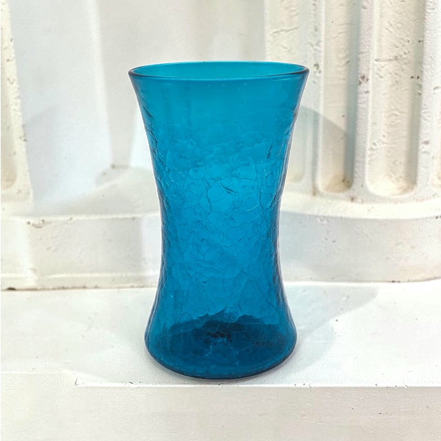 Designed by Wayne Husted for Blenko, model 5519-S exemplifies the sculptural optimism of 1950s American studio glass. The...
