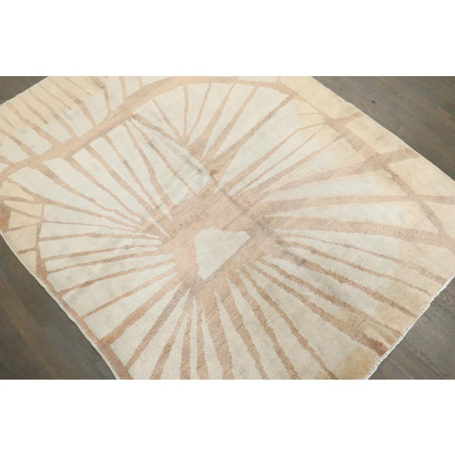 an Abstract Turkish Deco Geometric Sunburst Rug from the middle of the 20th century with a mid-century modern cubist...