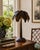 A chic vintage metal palm tree table lamp in the manner of Maison Jansen, with a sculptural trunk, layered palm frond...
