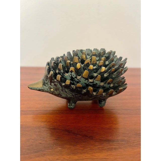 A rare complete set of six stackable hedgehogs in patinated brass, produced by Silex in France in the 1950s–60s, based on...