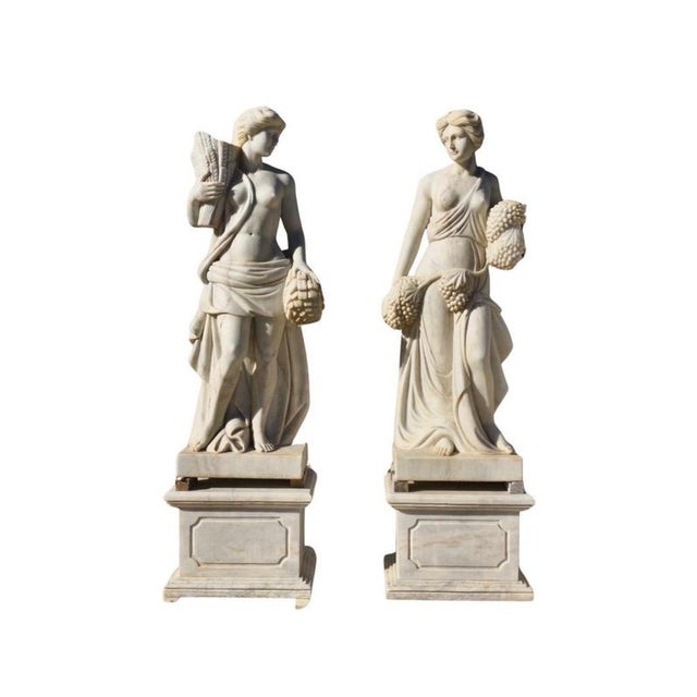 A remarkable set of four solid marble sculptures, each representing one of the Four Seasons with timeless elegance and...