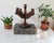 Vintage Spanish revival style carved wood five are candelabra. No makers mark. Some age wear. It is crooked.