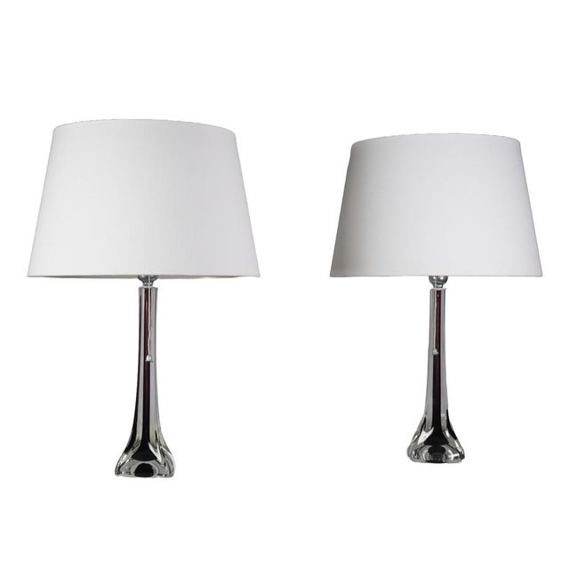 A refined pair of swedish mid-century table lamps designed by paul kedelv and produced by flygsfors glasbruk in the 1950s....