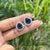 These halo stud earrings feature 8.01 carats of pear-cut blue sapphires, set in 14k white gold. Each center stone measures...