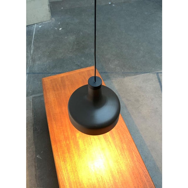 Simple pendant lamp from the well -known manufacturer Staff. The shape of the umbrella is tulip. In the upper area, the...