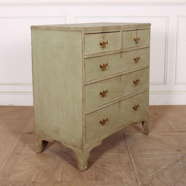 Late 18th Century English painted chest of drawers with original brass handles and later paint.1790 This piece is designed...