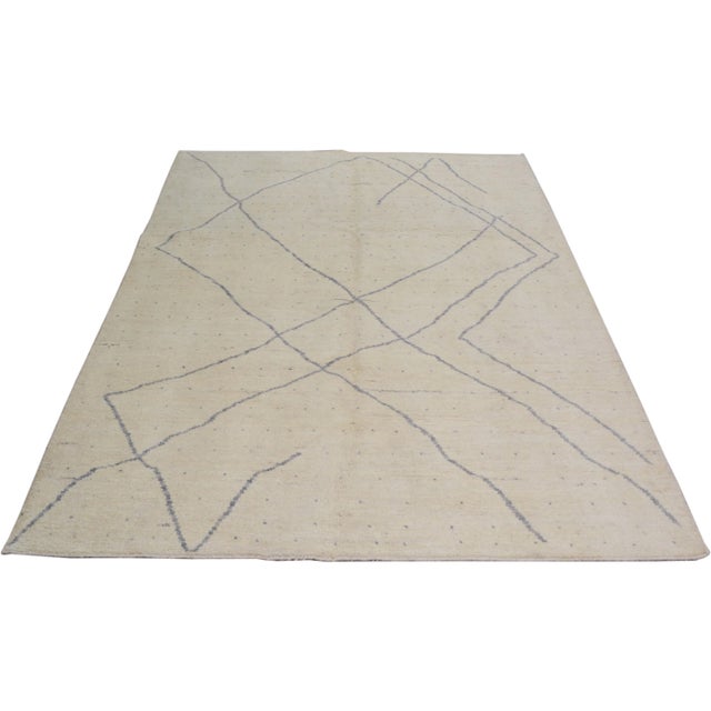 Moroccan hand knotted rug with natural colors, contemporary style and soft texture.