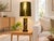 A striking Mid-Century Modern table lamp featuring a brutalist-style gold-tone cylindrical body with tiered, ridged...