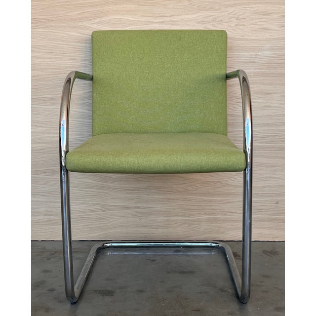 These tubular Brno chairs by Mies van deer Rohe have stainless steel frames and are upholstered in Eames green fabric,...