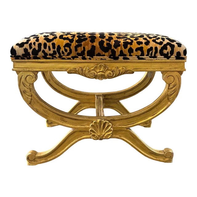 This is a pair of mid-century Italian carved giltwood ottomans with new leopard velvet upholstery. They are unmarked and...
