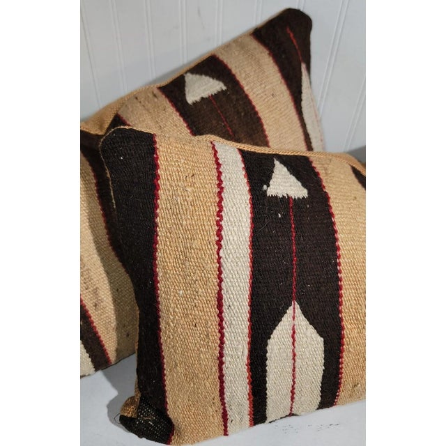 Hand made weaving pillows with feather and arrows pattern in fine condition with cotton linen backings. The inserts are...