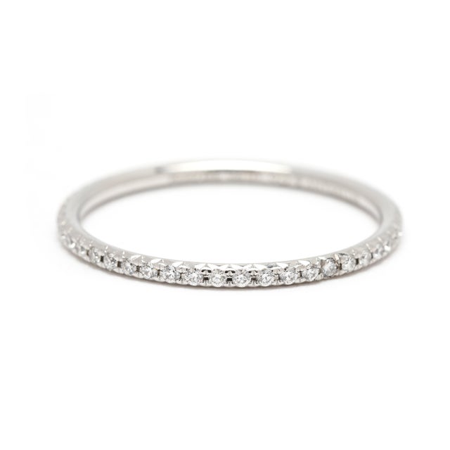 Stones: diamond round brilliant cut 1.1 mm approximately .20 total carats DEF color/ VS1-2 clarity Ring Size: 8.25 Rise...