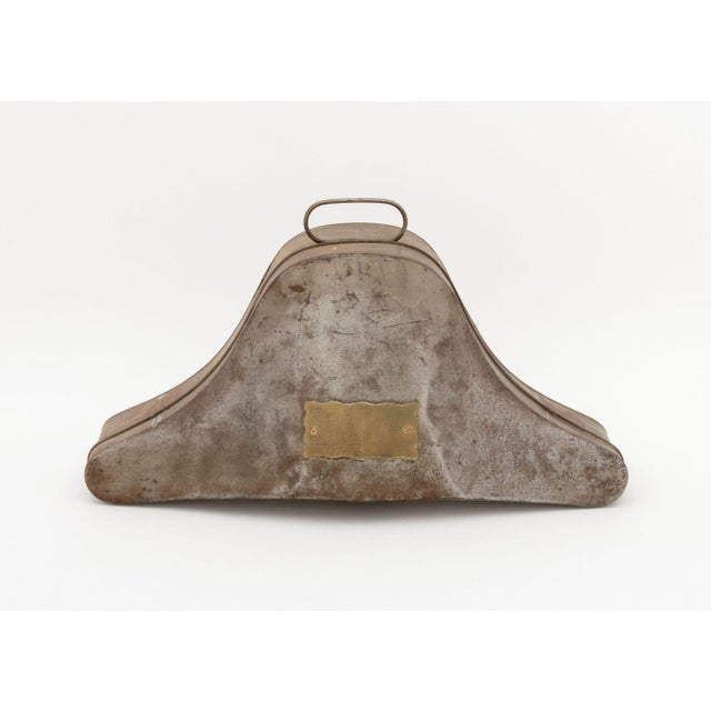 Military Bicorn Hat Tin Box, circa 1900, mounted with brass plate. 9.25" H x 18.25" W x 8" D. Provenance: The Estate of...