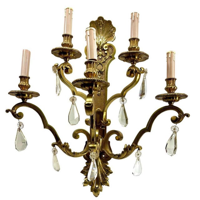 Bronze sconce (electroliers) in the Louis XVI style, with 5 candle-fittings for electric lamps. Decorated with ribbons and...