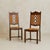A set of six French dining chairs dating to the 1940s, crafted in oak with handwoven rush seats. The tall backs feature...