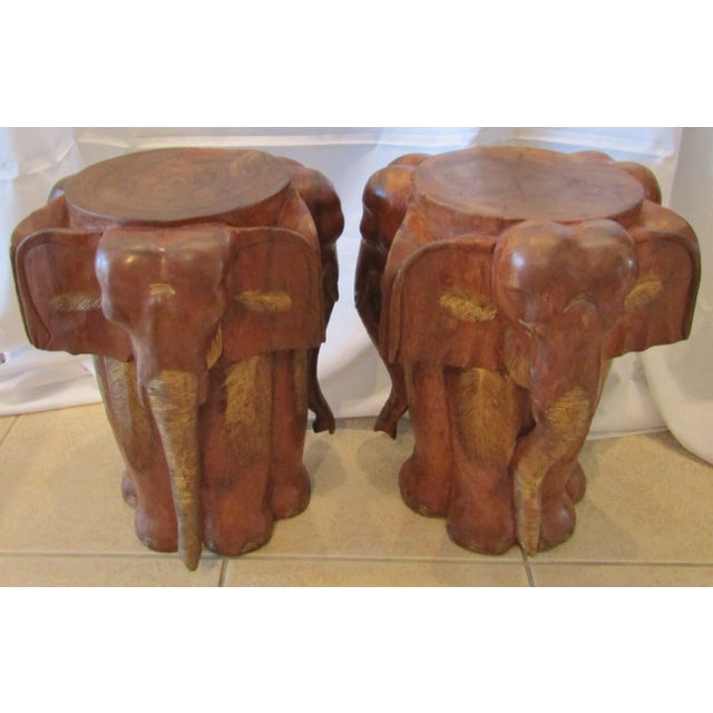 Vintage Matched Pair Carved Wood Elephant Stools / Tables circa 1970's This matched pair of stools / tables / plant stands...